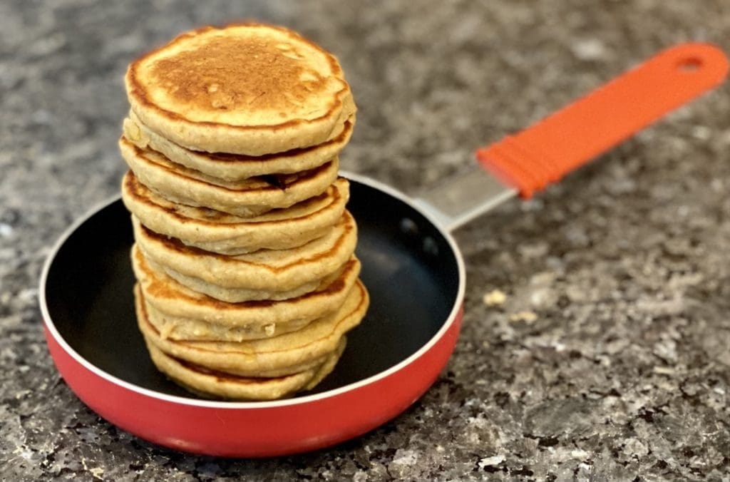 mini banana oat pancakes in a frypan