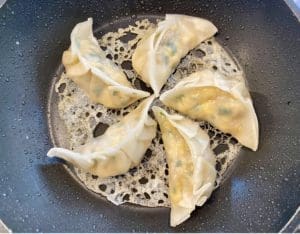 cooking prawn pork potstickers