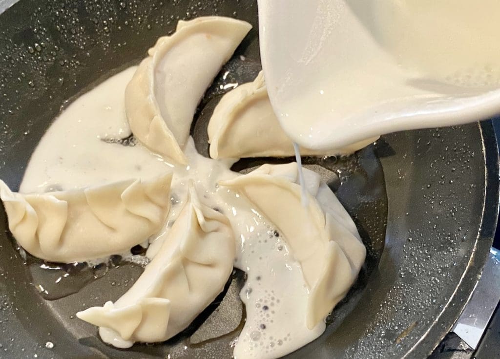 cooking prawn pork potstickers