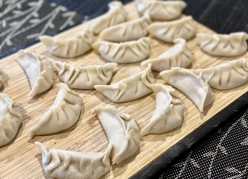 wrapping up pork prawn potstickers
