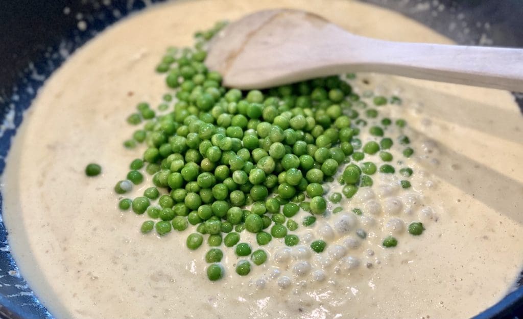 adding ingredients to the sauce