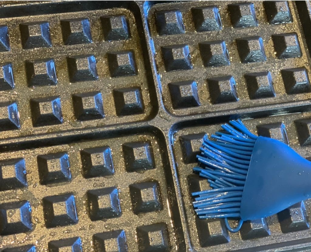 greasing the waffle plates