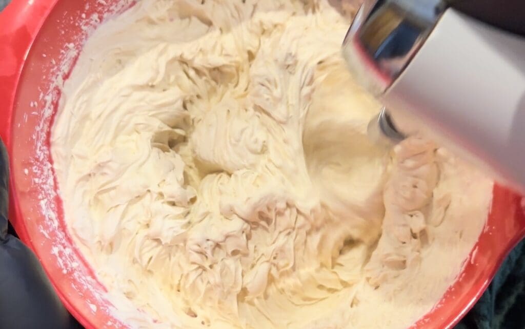 mixing coffee into cream